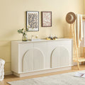 Buffet contemporain blanc avec quatre portes arrondies, finition mate et grand espace de rangement pour salon
